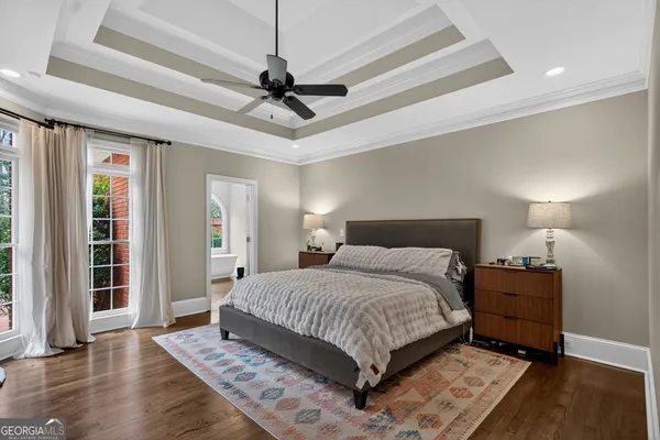 a very nice looking room with a large window and a chandelier