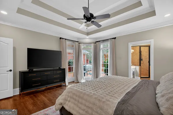 a view of walk in closet with clothes