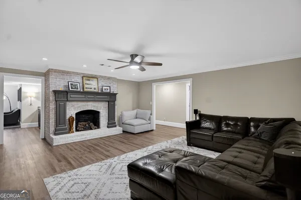 a bathroom with a granite countertop toilet and a shower