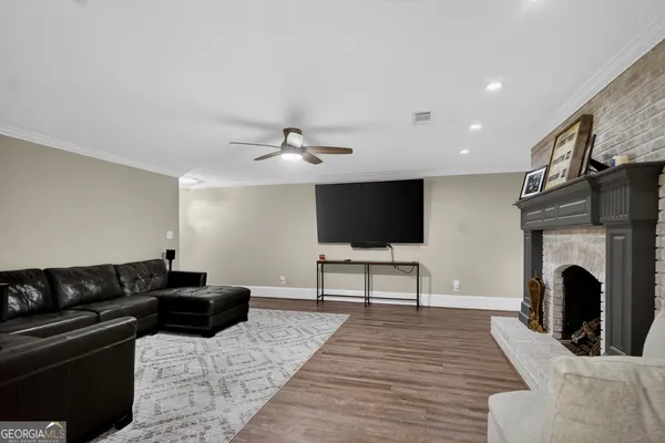 a view of a livingroom with furniture and wooden floor