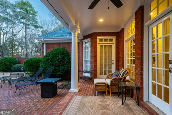 a view of a chair and table in backyard