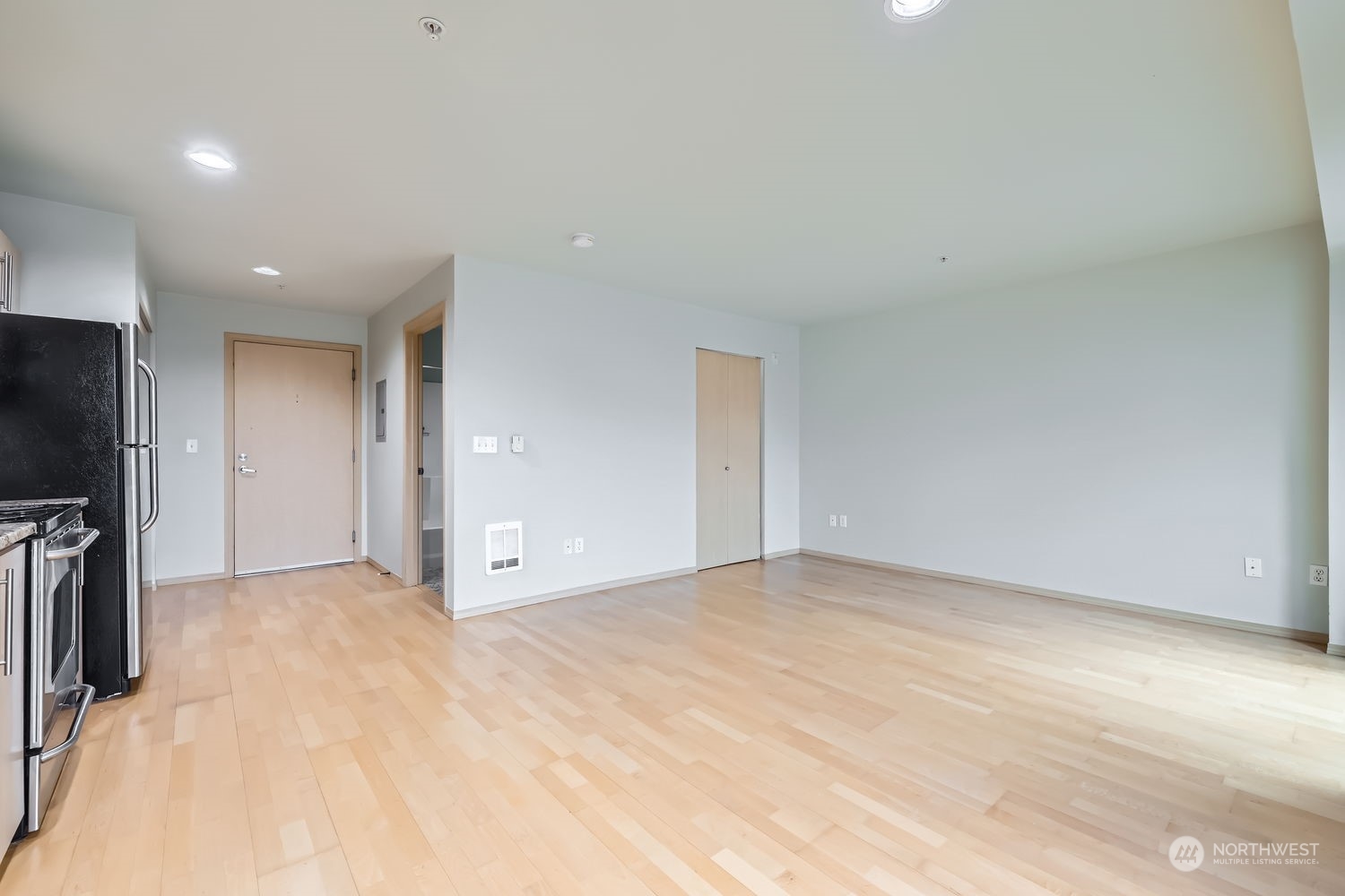 424 North 85th Street, Unit 304 Seattle, WA 98103 - Photo 7 of 27 a view of an empty room with a fireplace