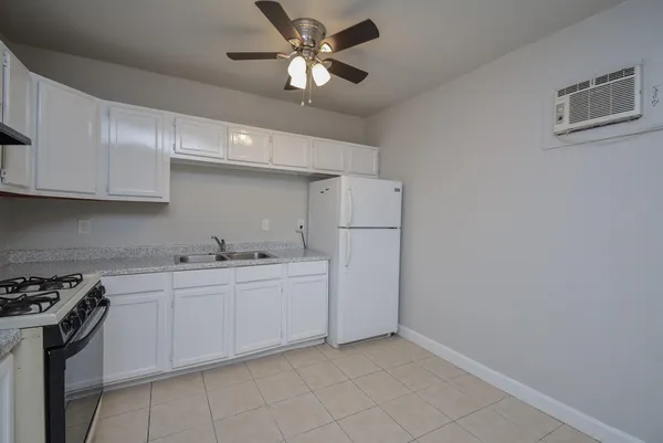 a kitchen with a sink cabinets and stainless steel appliances