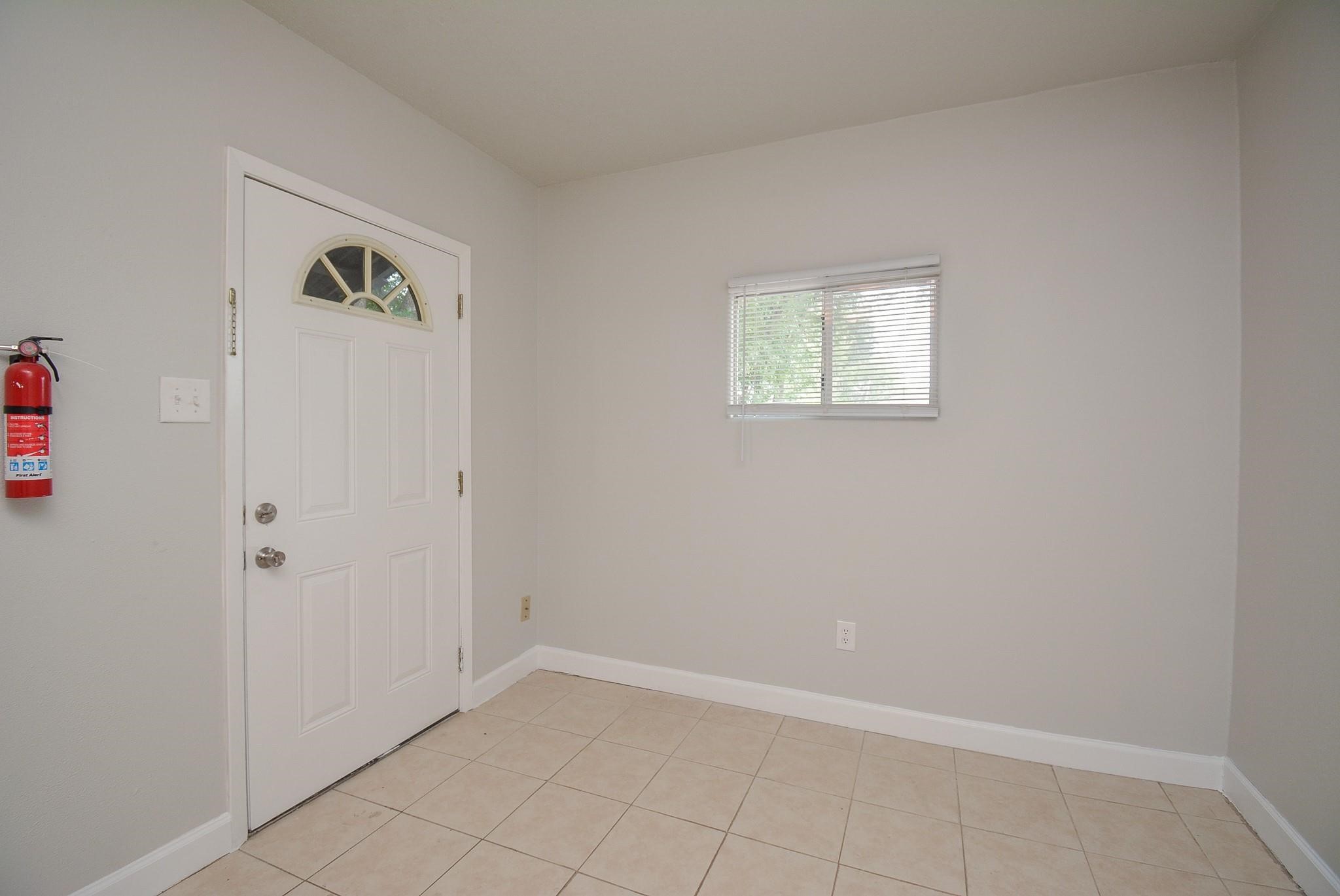 2117 Thonig Road, Unit B Houston, TX 77055 - Photo 2 of 25 an empty room with windows