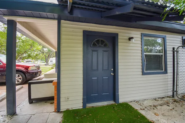a view of a door and chair and door in the porch