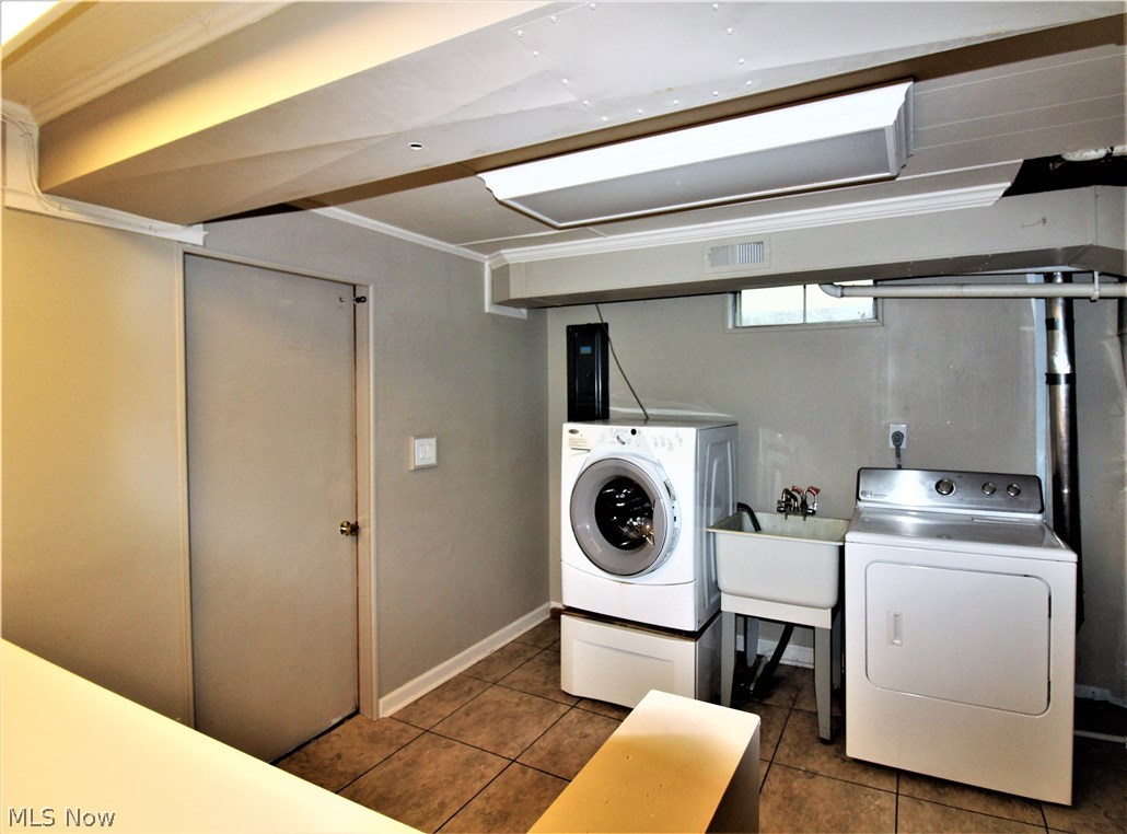 2887 Lee Road Silver Lake, OH 44224 - Photo 21 of 24 Lower Level Laundry Area with Utility Sink