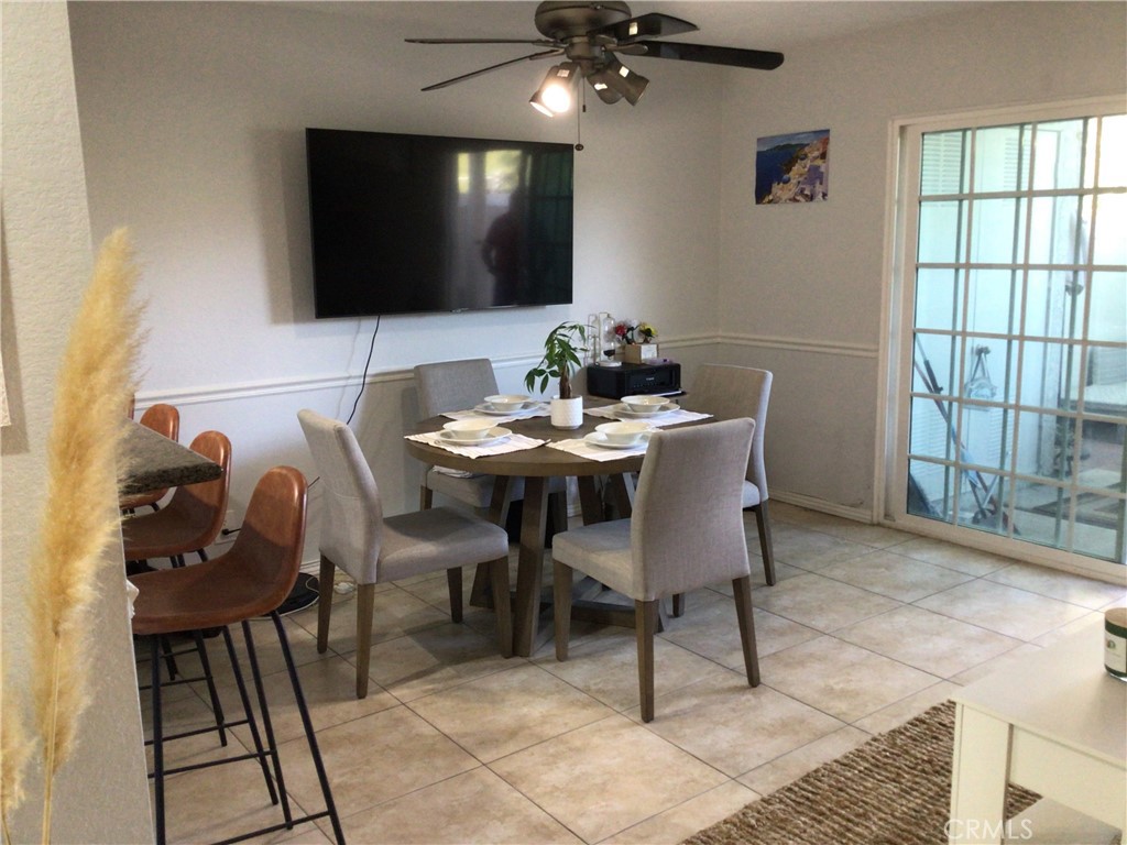 26161-815 Del Rey, Unit C Mission Viejo, CA 92691 - Photo 2 of 11 a dining room with furniture and wooden floor