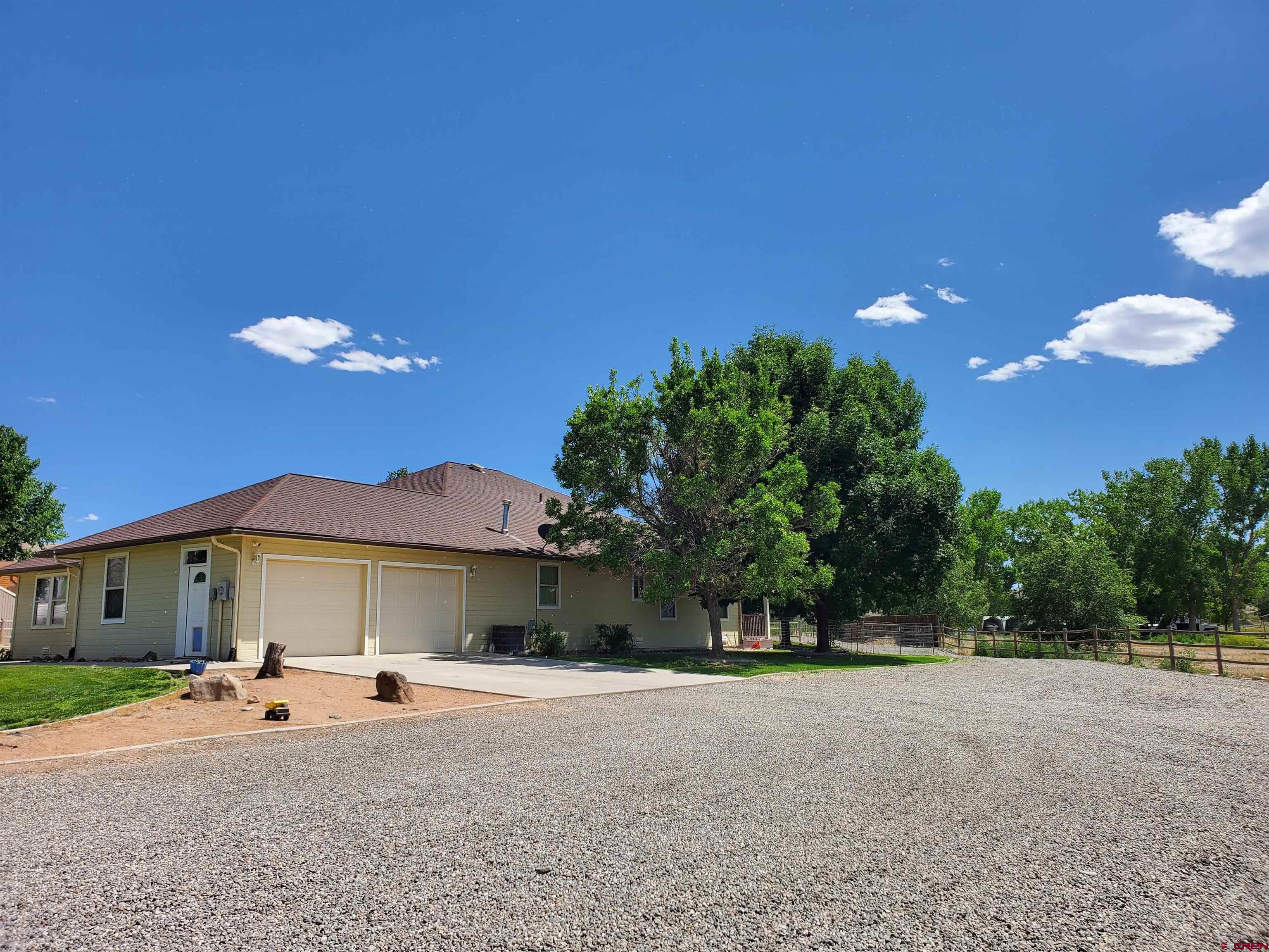 7095 Buena Vista Road Delta, CO 81416 - Photo 2 of 33 a view of a house with a yard and sitting area