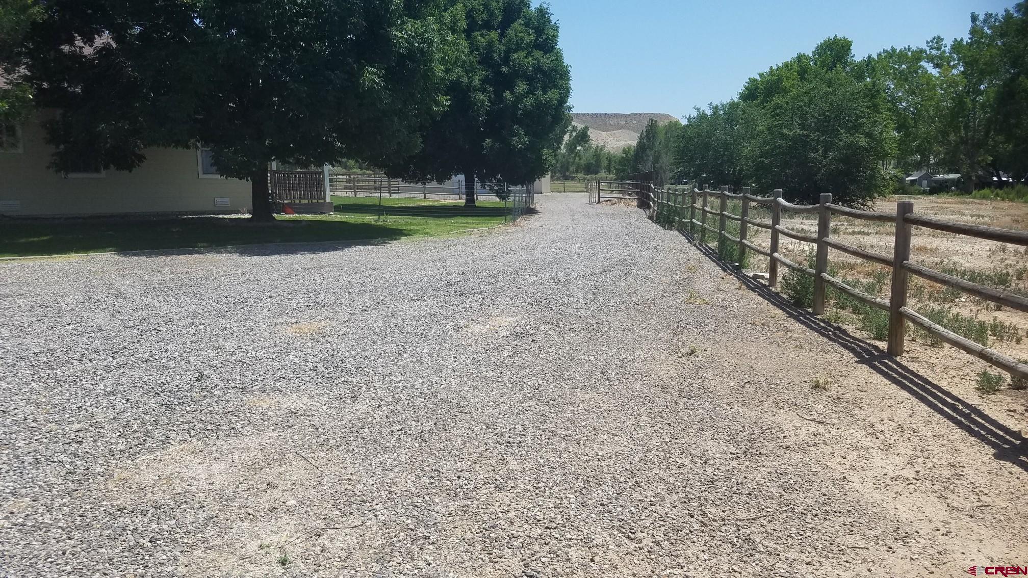 7095 Buena Vista Road Delta, CO 81416 - Photo 21 of 33 a backyard of a house with lots of green space