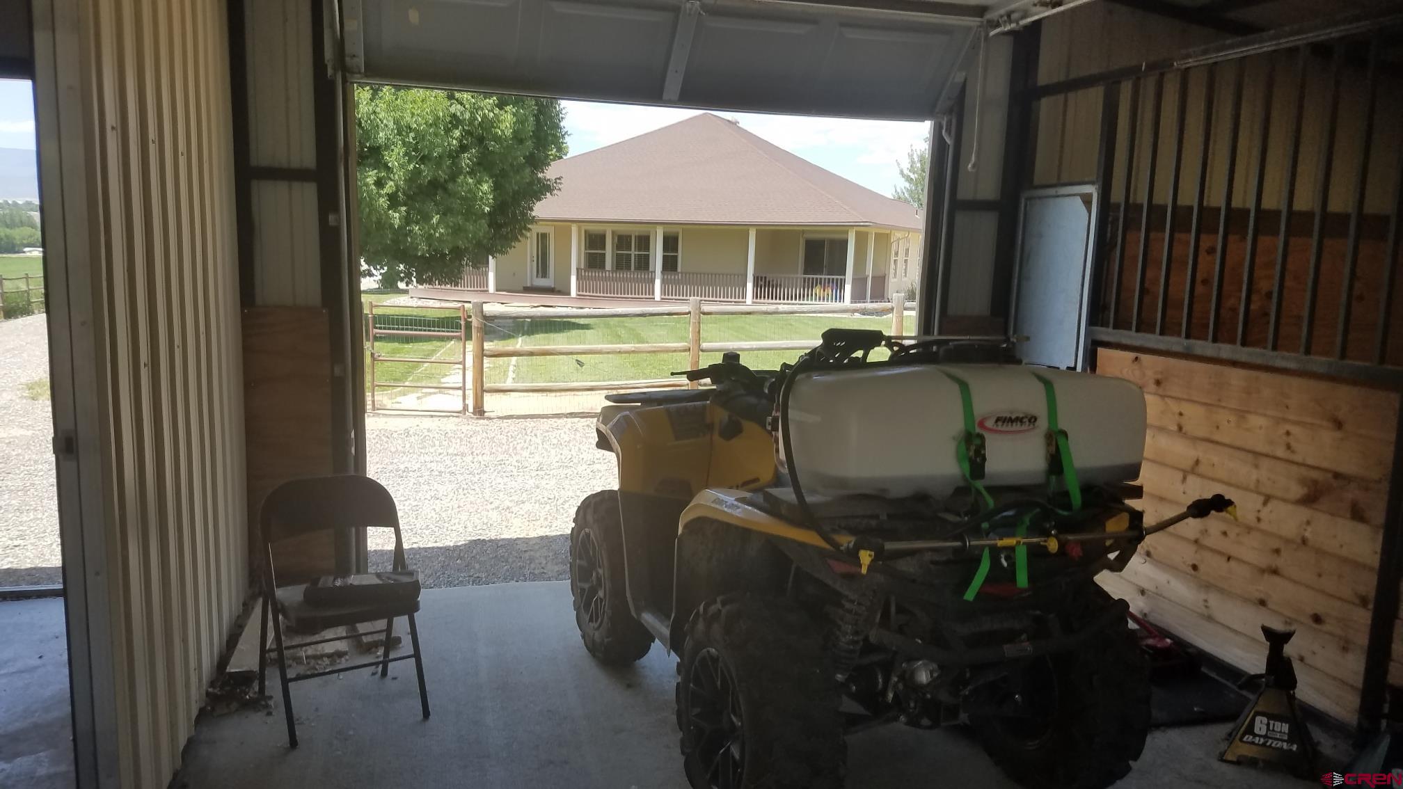 7095 Buena Vista Road Delta, CO 81416 - Photo 26 of 33 a living room with furniture and a floor to ceiling window