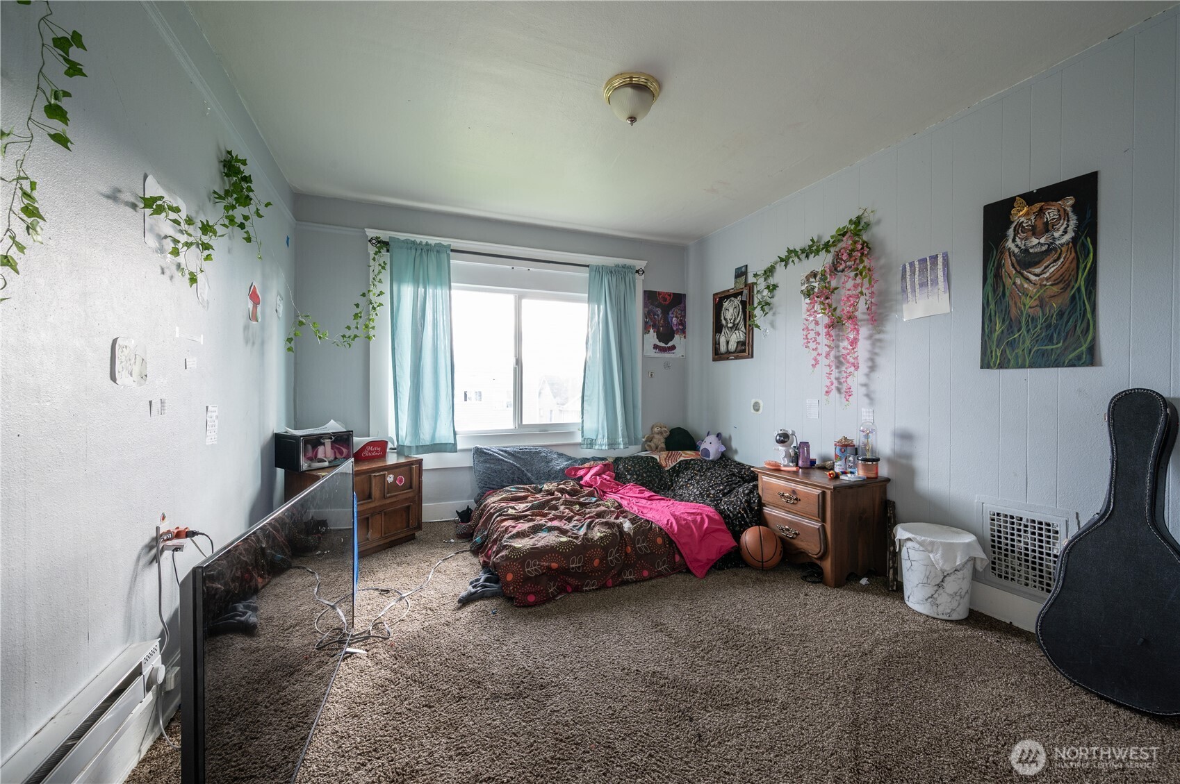 300 West 3rd Street Aberdeen, WA 98520 - Photo 16 of 28 a bedroom with furniture and a window