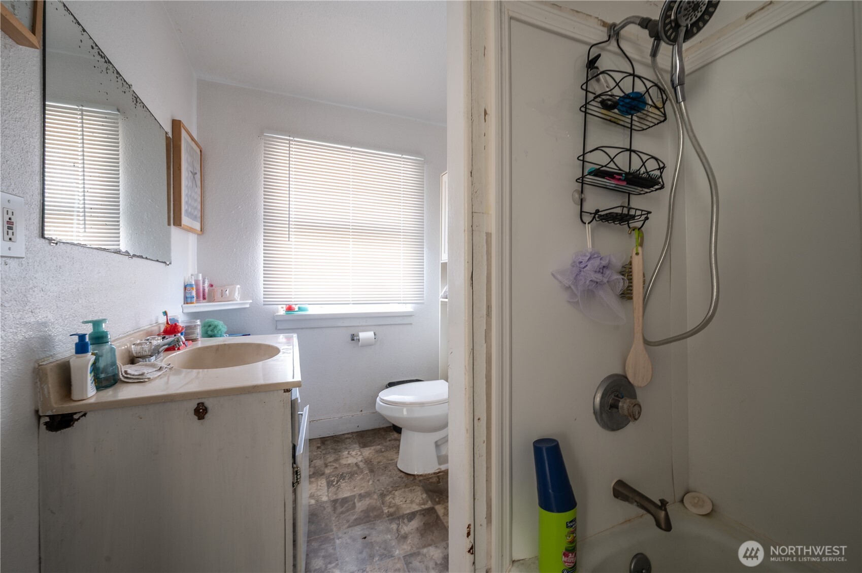 300 West 3rd Street Aberdeen, WA 98520 - Photo 21 of 28 a bathroom with a sink mirror vanity and toilet
