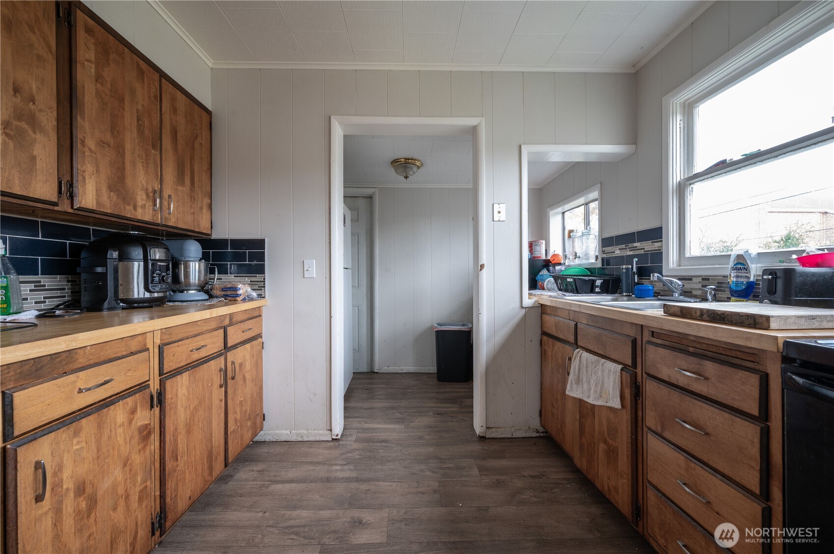 300 West 3rd Street Aberdeen, WA 98520 - Photo 7 of 28 a kitchen with stainless steel appliances granite countertop a refrigerator and a stove top oven