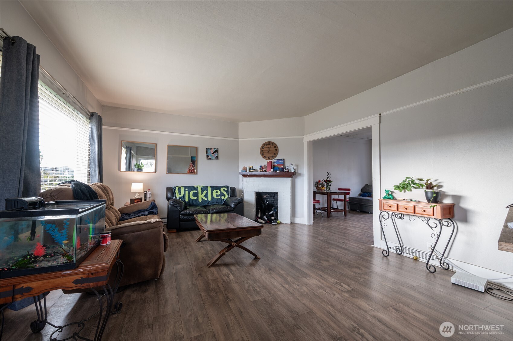 300 West 3rd Street Aberdeen, WA 98520 - Photo 8 of 28 a living room with furniture and a wooden floor