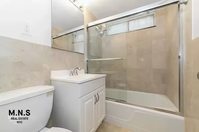 a bathroom with a sink a toilet and a bathtub