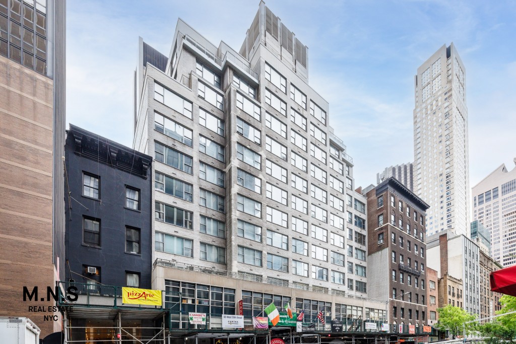 65 West 55th Street, Unit 10P Manhattan, NY 10019 - Photo 4 of 16 a front view of a building