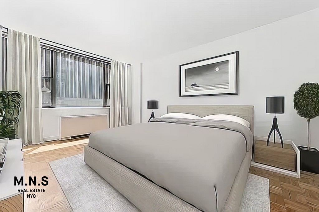 65 West 55th Street, Unit 10P Manhattan, NY 10019 - Photo 6 of 16 a bedroom with a bed and a painting on the wall