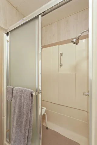 a bathroom with a bathtub and a shower