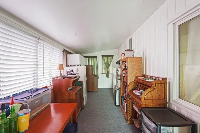 a bedroom with furniture and a window