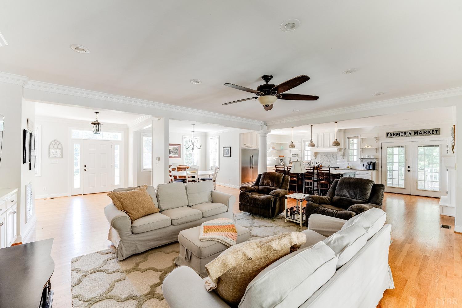 212 Barringer Drive Rustburg, VA 24588 - Photo 19 of 63 a living room with furniture ceiling fan and a rug