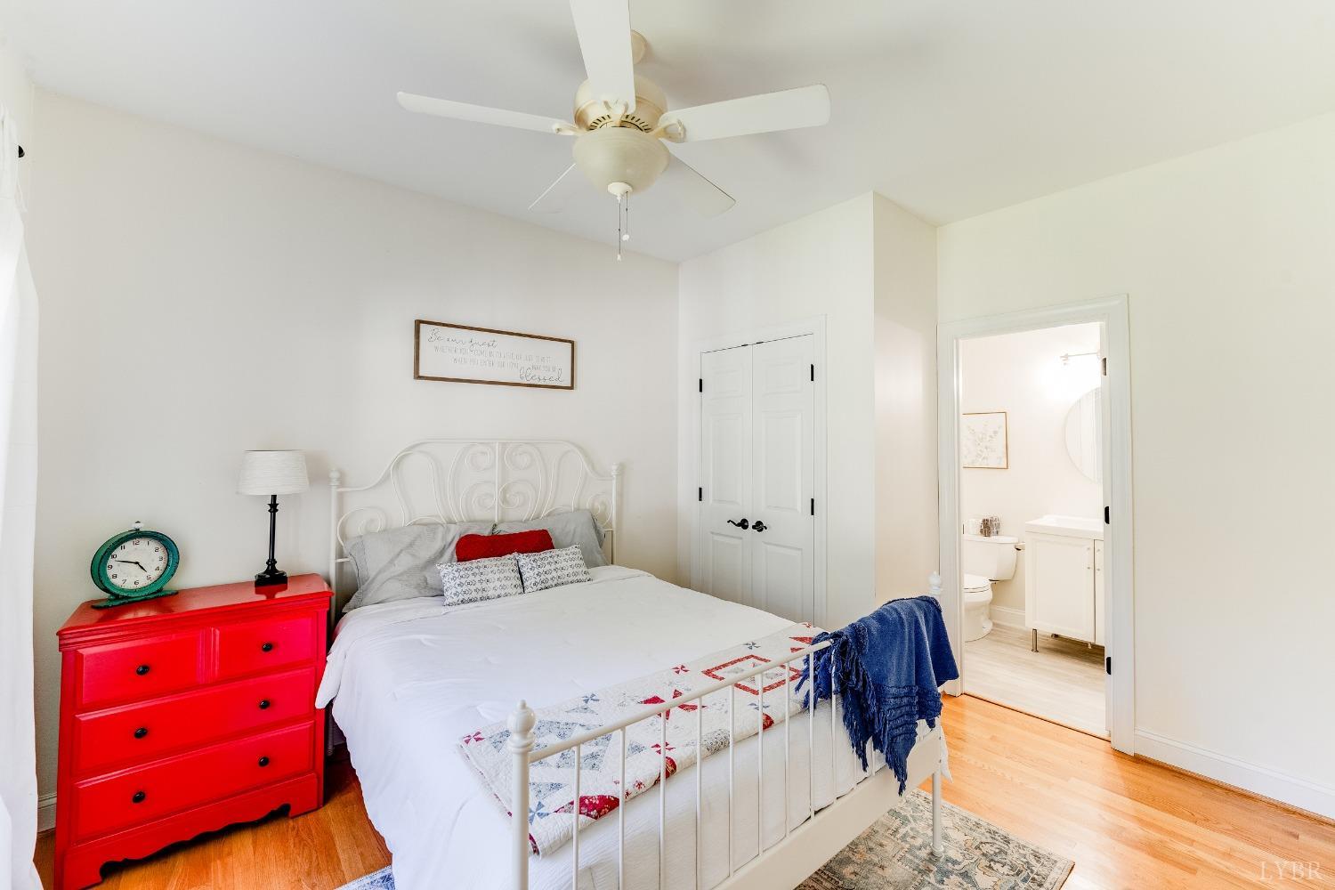 212 Barringer Drive Rustburg, VA 24588 - Photo 20 of 63 a bedroom with a bed and a chandelier