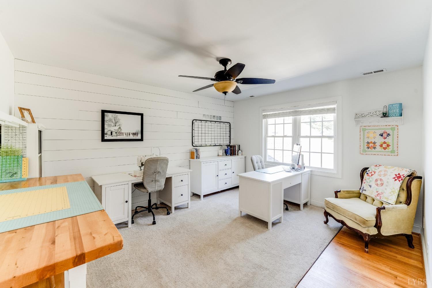 212 Barringer Drive Rustburg, VA 24588 - Photo 32 of 63 a living room with furniture and a window