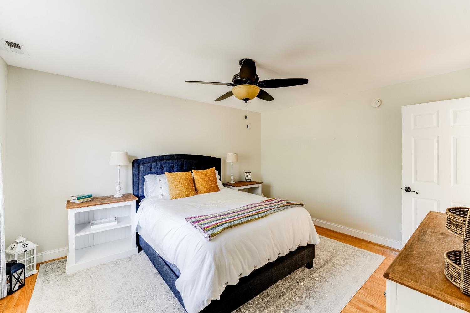 212 Barringer Drive Rustburg, VA 24588 - Photo 35 of 63 a bedroom with a bed and a lamp