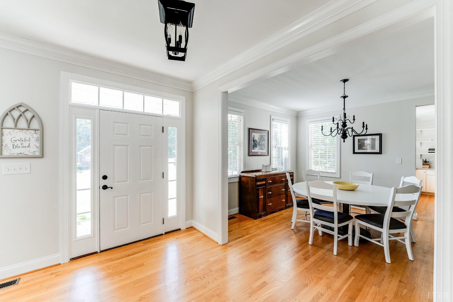 212 Barringer Drive Rustburg, VA 24588 - Photo 4 of 63 a view of a dining room with furniture and wooden floor