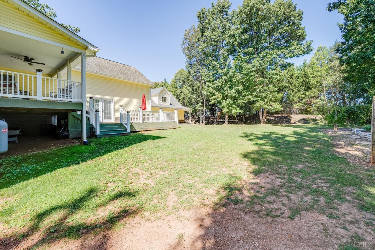 212 Barringer Drive Rustburg, VA 24588 - Photo 45 of 63 a view of a house with a yard and sitting area