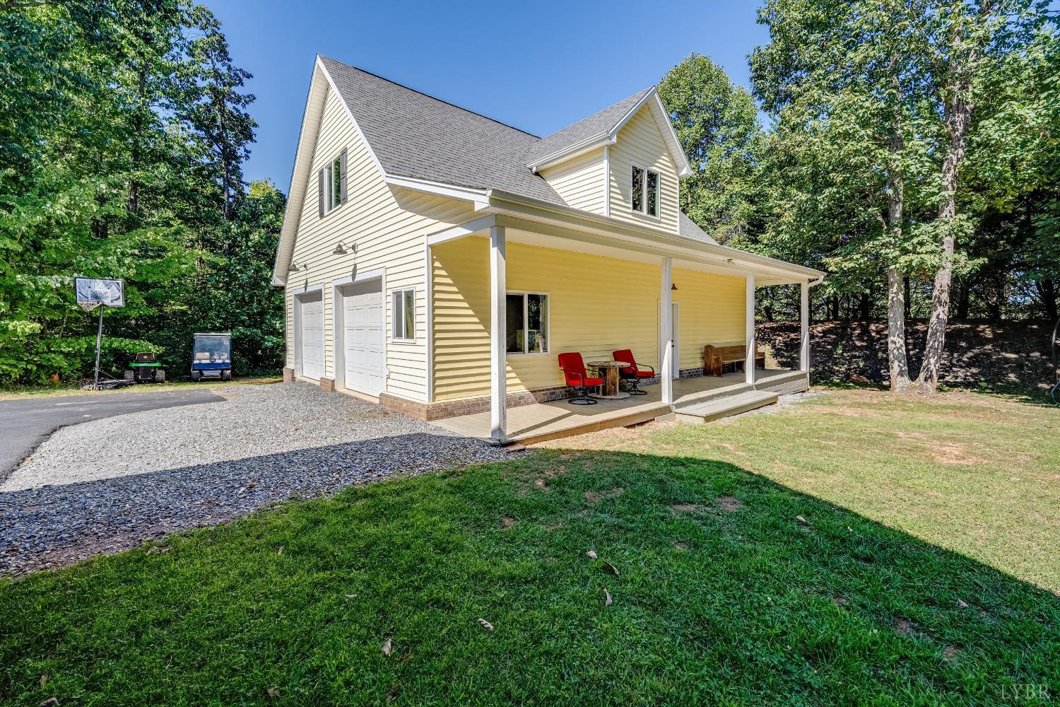 212 Barringer Drive Rustburg, VA 24588 - Photo 50 of 63 a view of a house with backyard and a tree