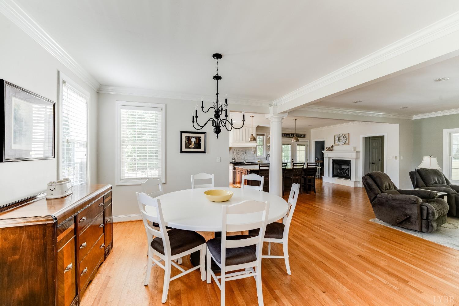 212 Barringer Drive Rustburg, VA 24588 - Photo 6 of 63 a view of a dining room with furniture window and wooden floor