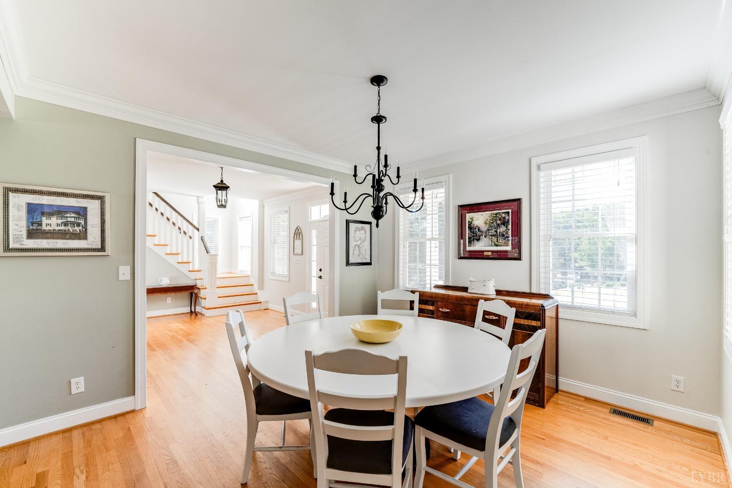 212 Barringer Drive Rustburg, VA 24588 - Photo 9 of 63 a view of a dining room with furniture and wooden floor