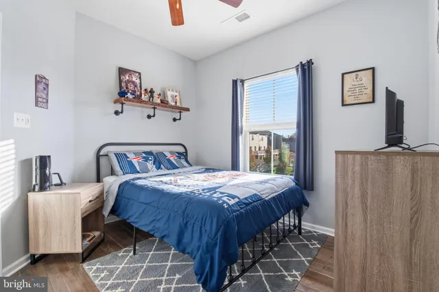 a bedroom with bed and a window