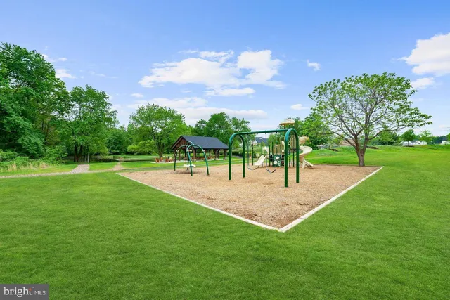 a view of a deck and yard with green space