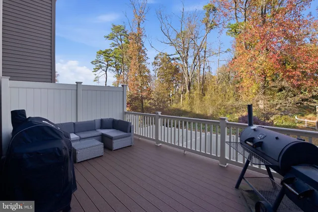 a view of balcony with furniture and wooden floor