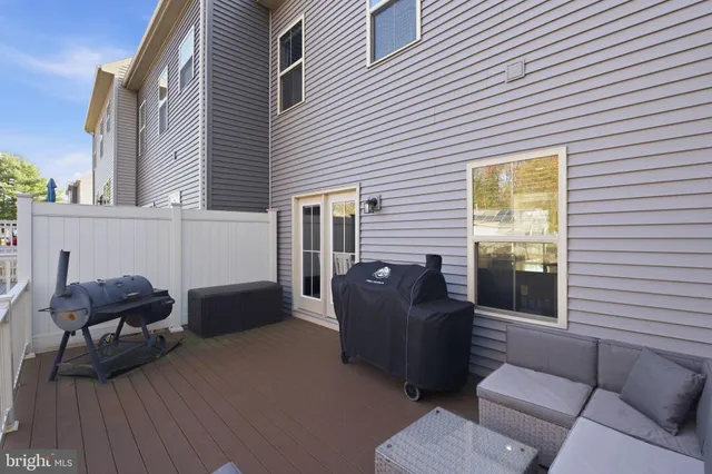 a balcony with furniture and a window