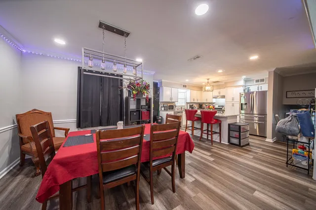 a dining room with furniture and window