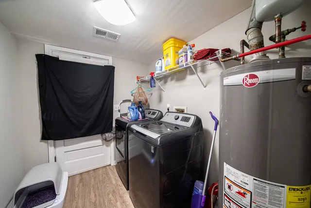 a living room with furniture and white walls