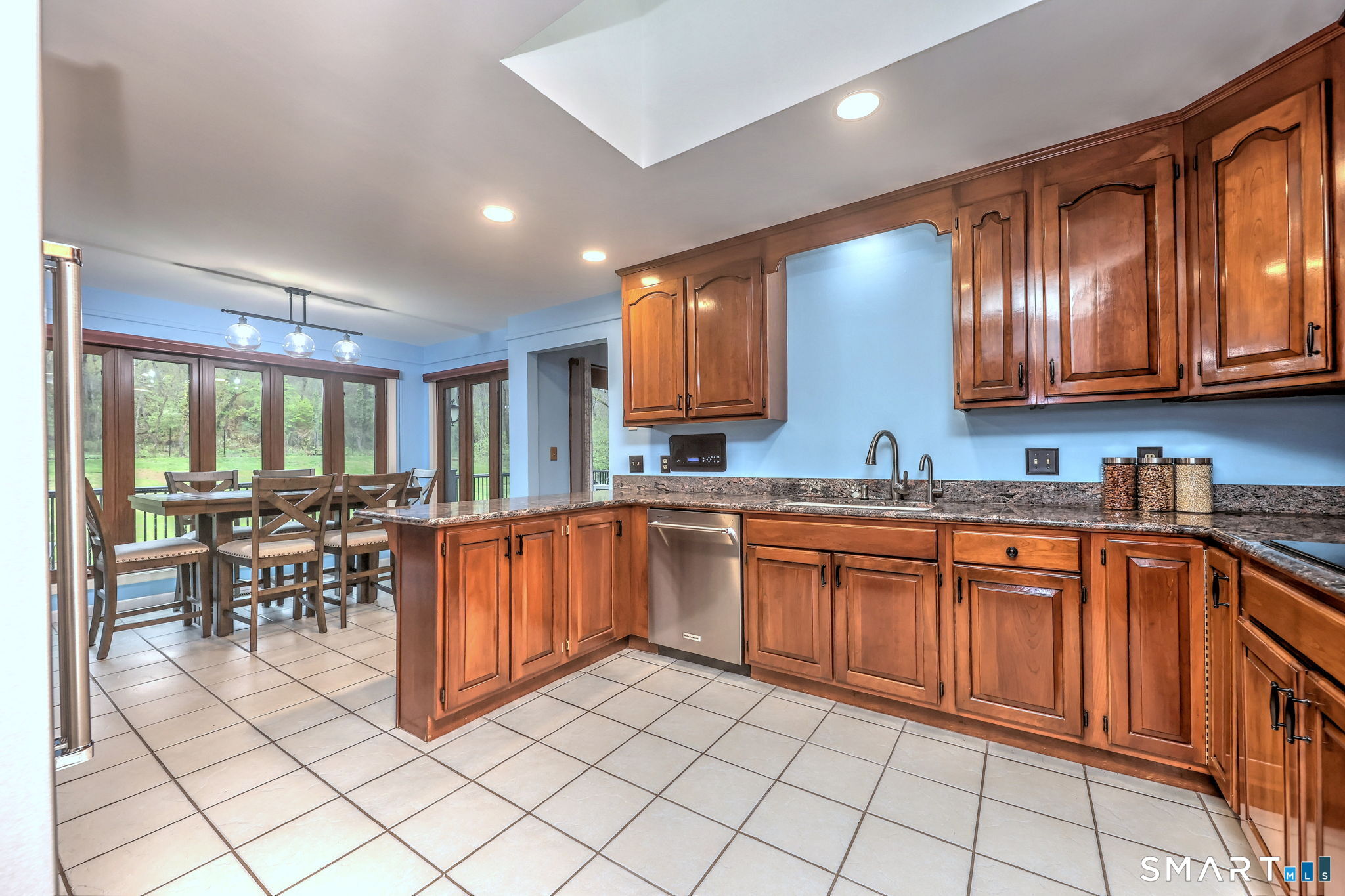 2262 Ridge Road North Haven, CT 06473 - Photo 4 of 40 a kitchen with stainless steel appliances granite countertop sink stove top oven and cabinets