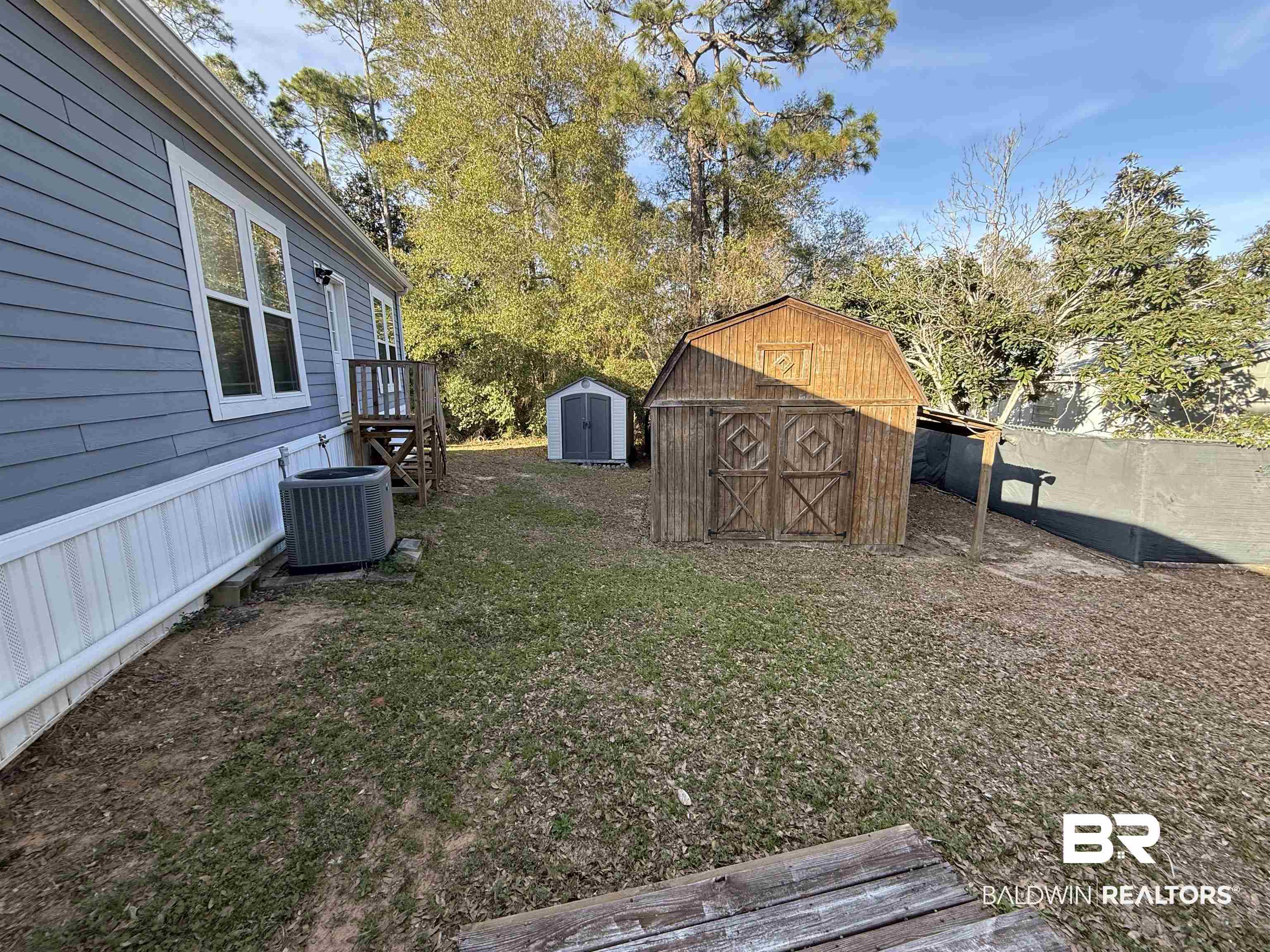 1274 Caney Loop Lillian, AL 36549 - Photo 5 of 19 View of grassy yard featuring a shed
