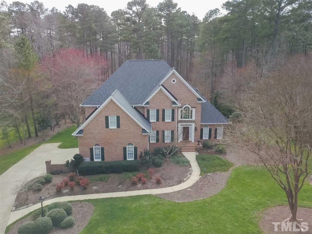 Stately mostly brick executive home situated on lushly landscaped 1.25 acre lot.