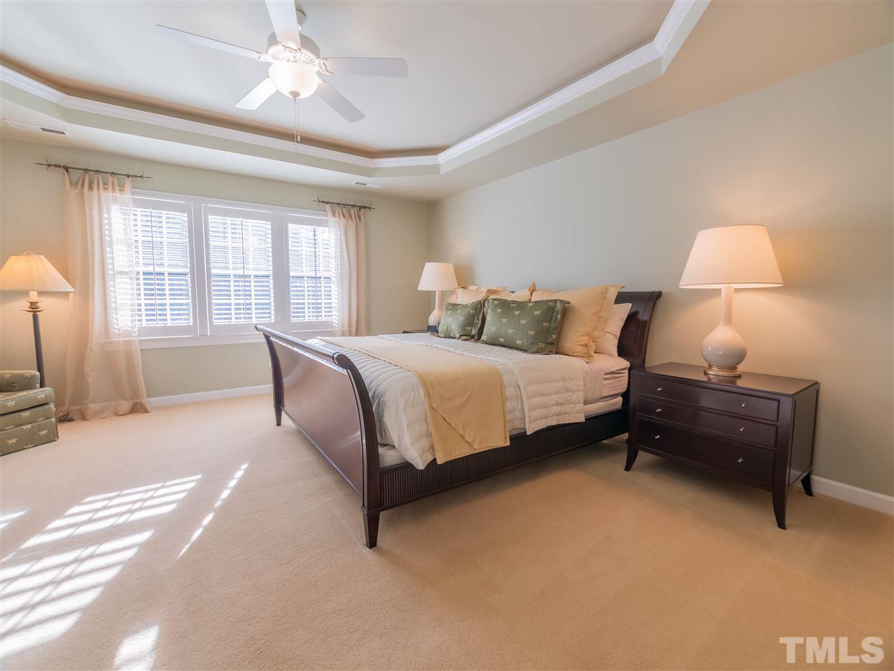 4016 White Chapel Way Raleigh, NC 27615 - Photo 15 of 30 The master bedroom features a tray ceiling with recessed lighting, custom shutters, updated ceiling fan and his & her walk-in closets.