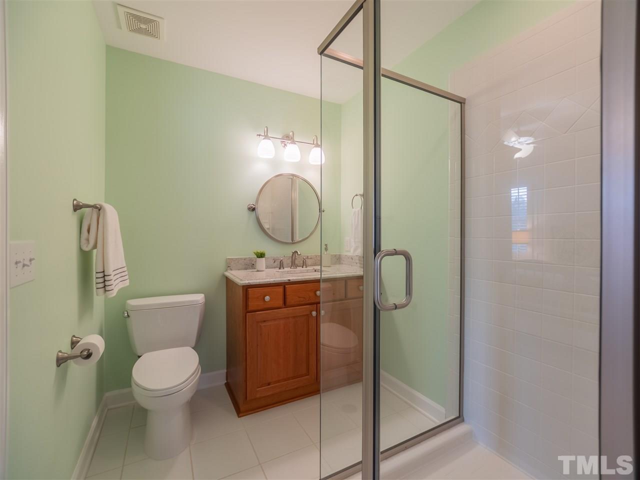 4016 White Chapel Way Raleigh, NC 27615 - Photo 19 of 30 This Jack and Jill bath is updated with a new shower surround, comfort height cabinet, granite top with u/m sink, brushed nickel fixtures and Toto commode.
