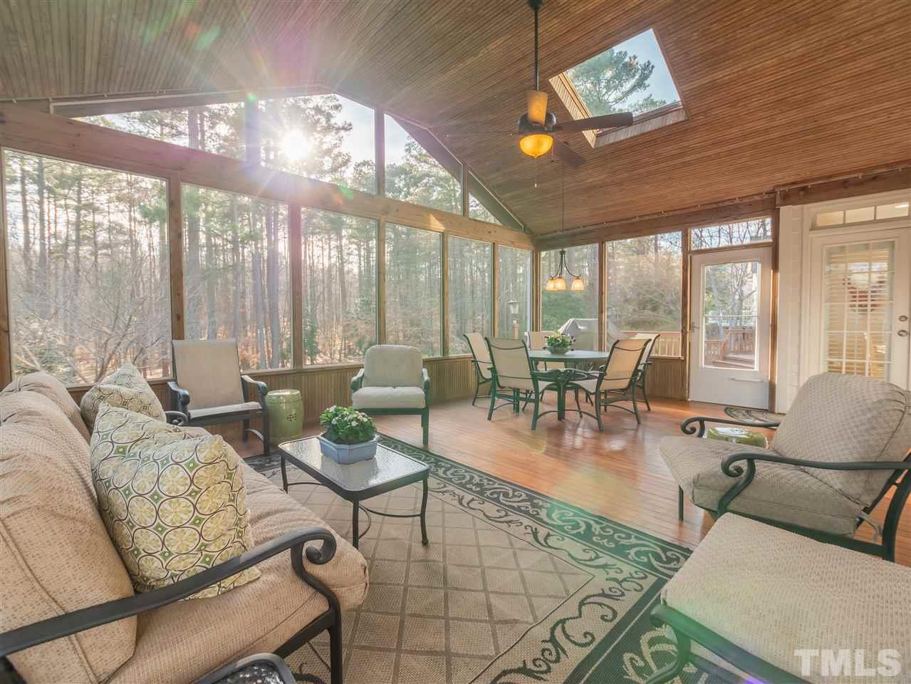 4016 White Chapel Way Raleigh, NC 27615 - Photo 26 of 30 Oversized custom screened-in porch by Archideck features tongue and groove vaulted ceiling and floors, skylights and ceiling fan.