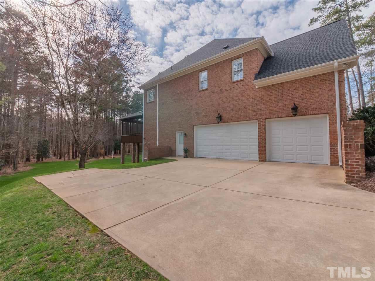 4016 White Chapel Way Raleigh, NC 27615 - Photo 29 of 30 Tall three car garage offers loads of additional storage.