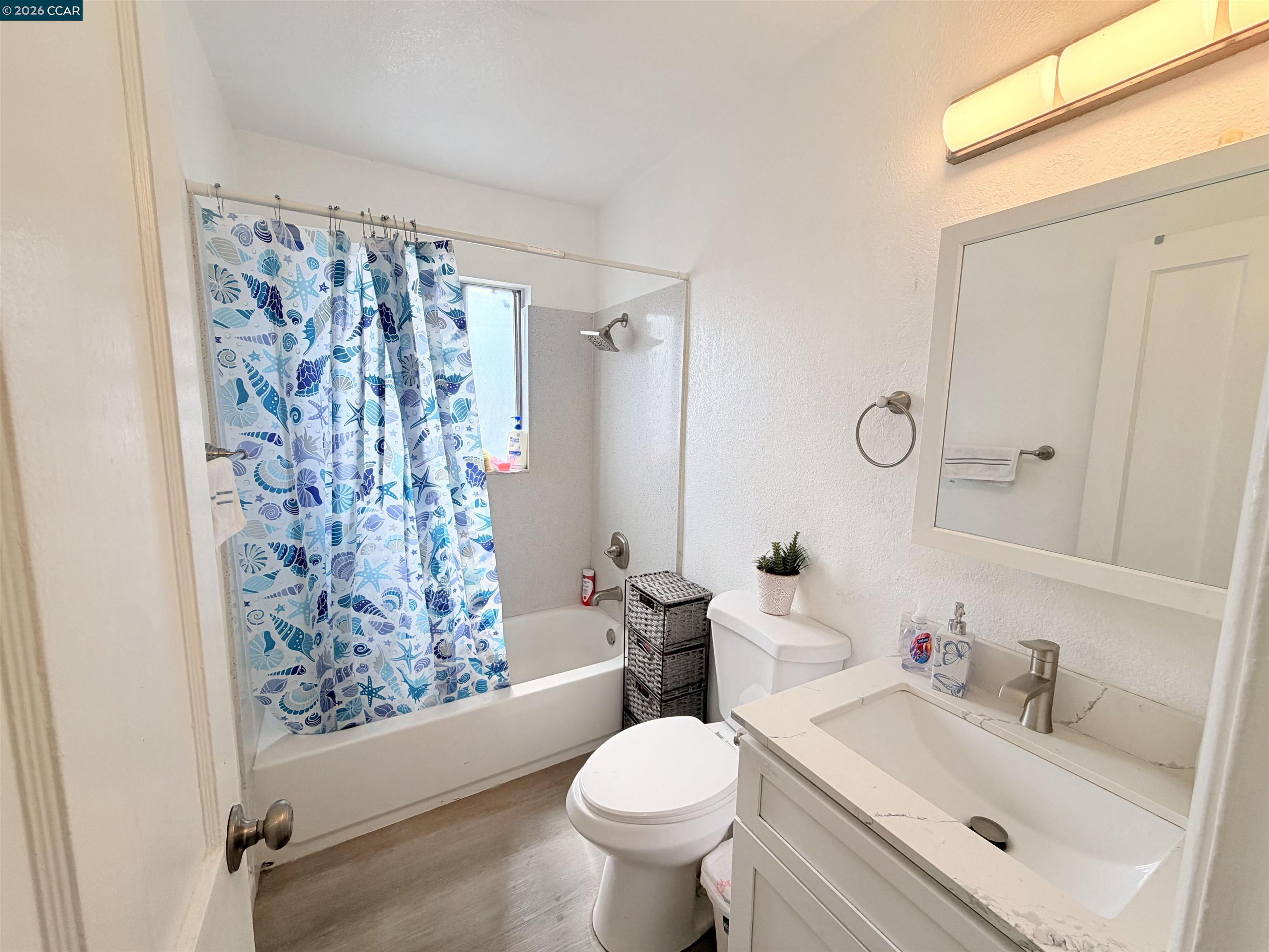 238 Fitzpatrick Road Oakland, CA 94603 - Photo 11 of 18 a bathroom with a sink toilet and shower