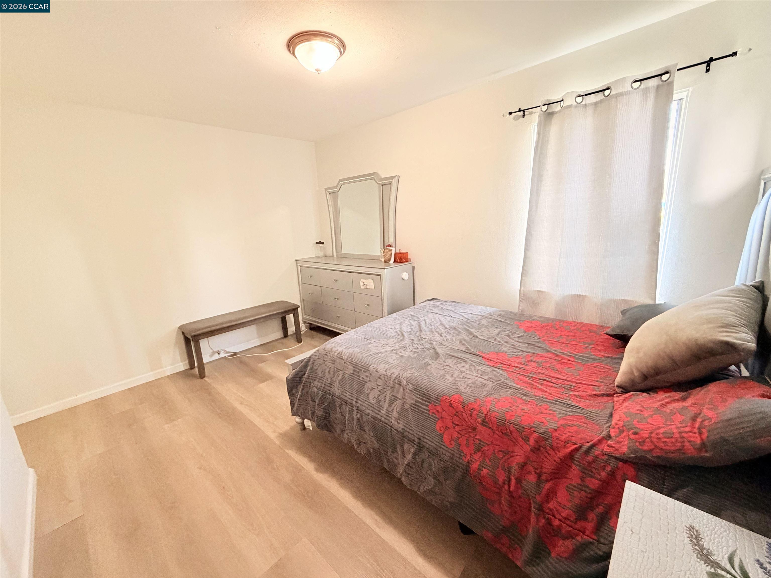 238 Fitzpatrick Road Oakland, CA 94603 - Photo 14 of 18 a bedroom with a bed and a mirror