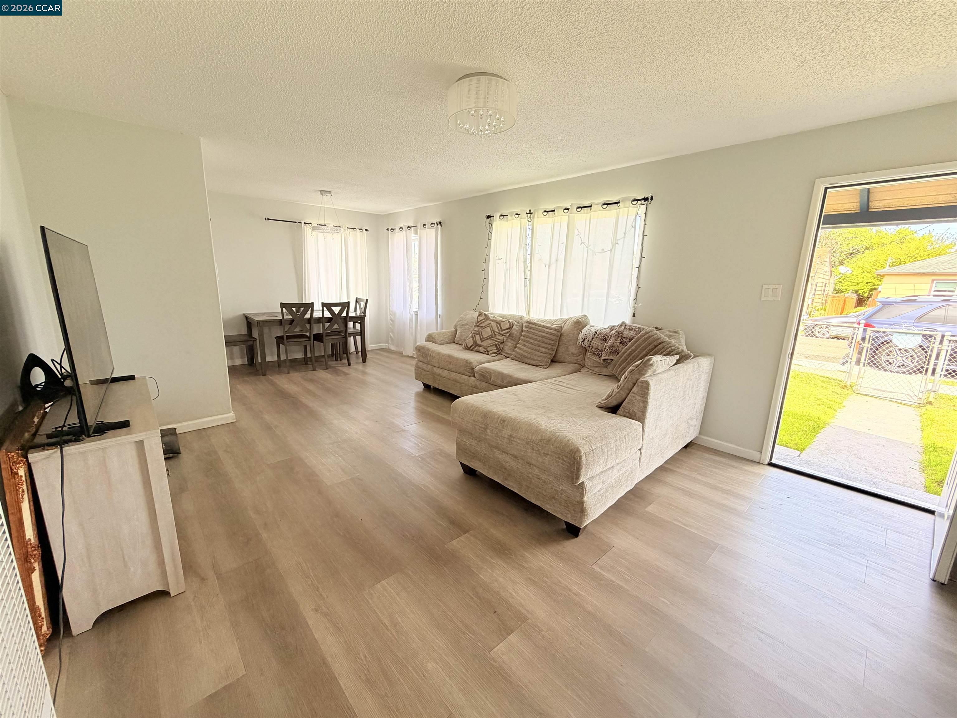 238 Fitzpatrick Road Oakland, CA 94603 - Photo 3 of 18 a living room with furniture and a wooden floor