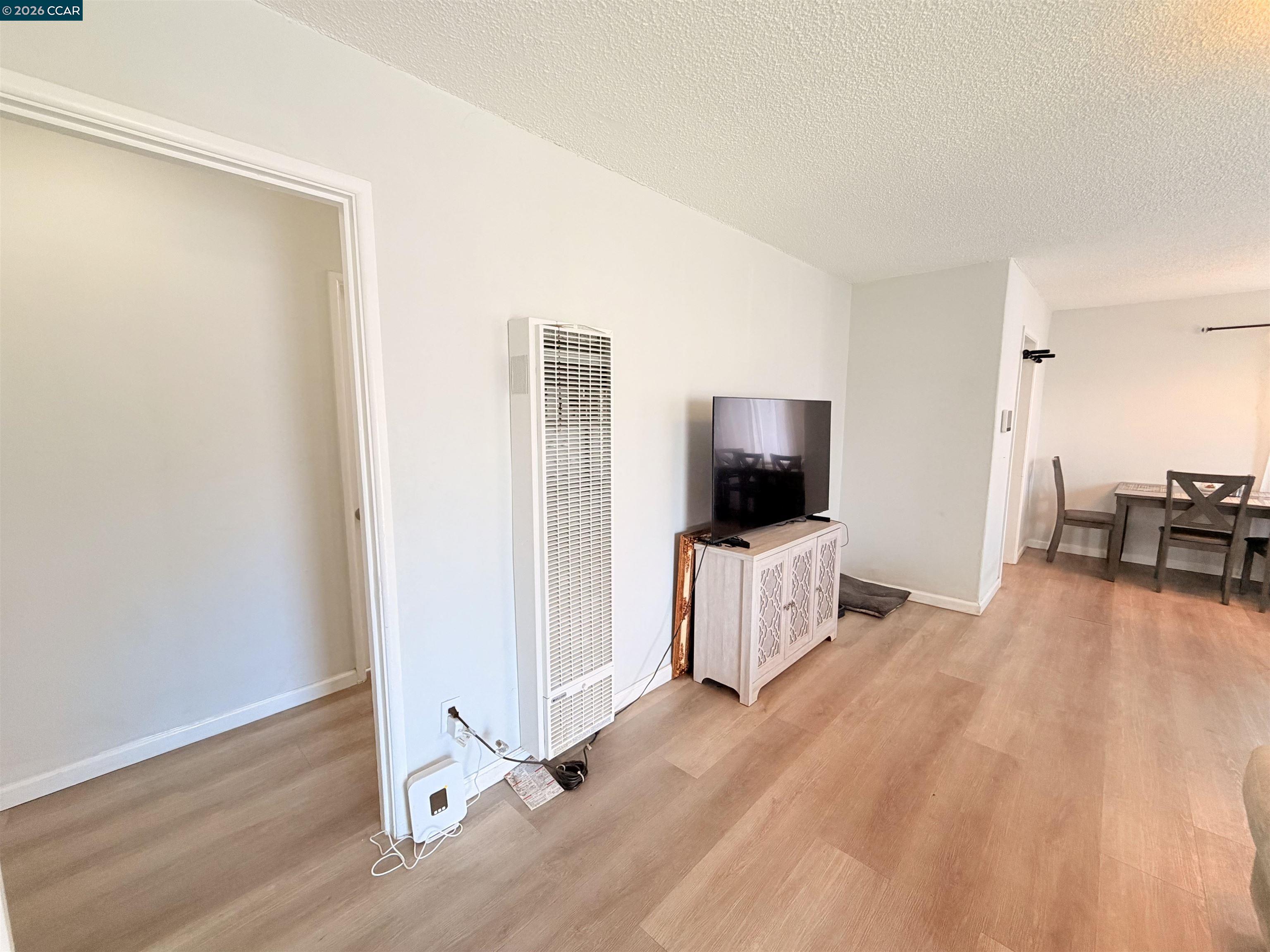 238 Fitzpatrick Road Oakland, CA 94603 - Photo 4 of 18 a living room with furniture and a flat screen tv