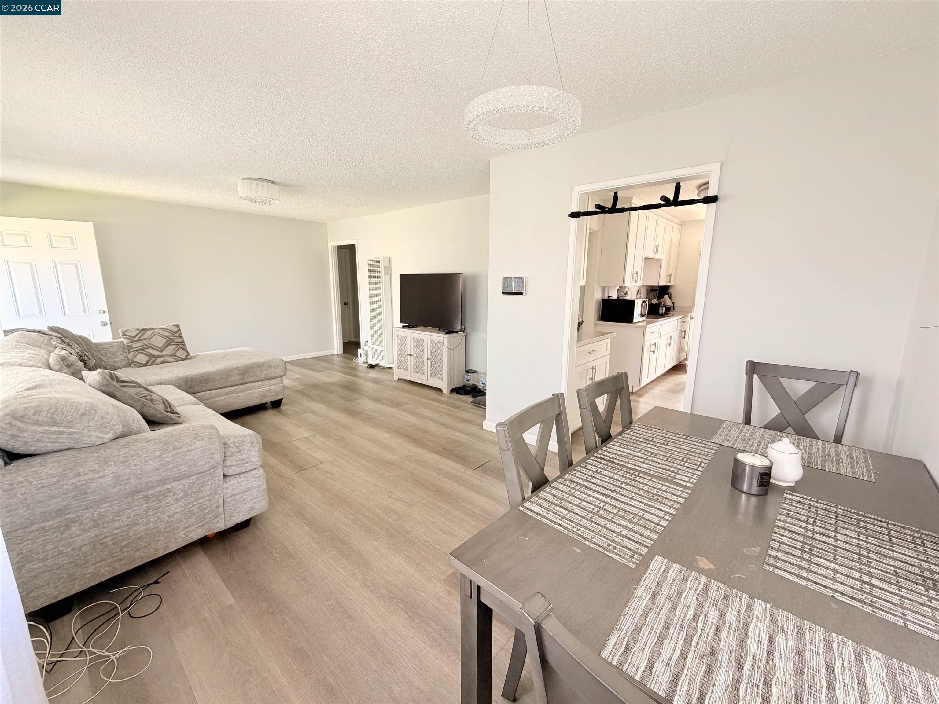 238 Fitzpatrick Road Oakland, CA 94603 - Photo 5 of 18 a living room with furniture and a flat screen tv